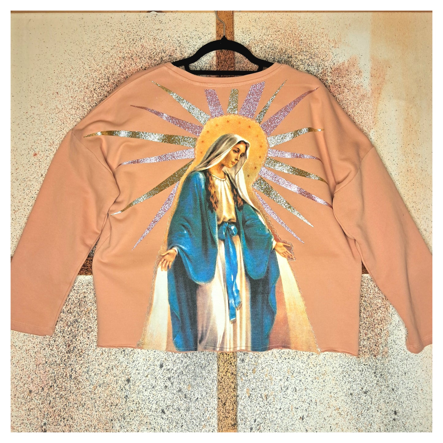 recycled, upcycled pink pullover with our lady of guadalupe pattern. glitter heat press