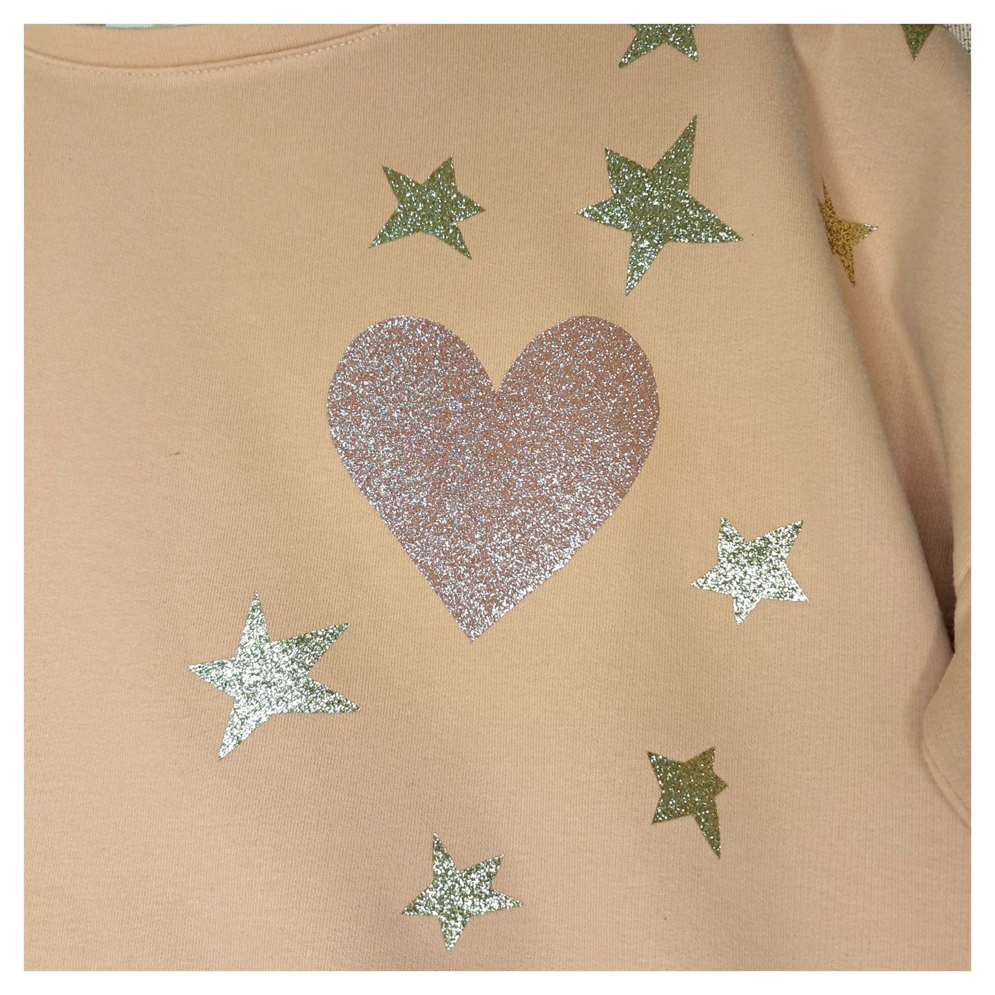 recycled, upcycled pink pullover with our lady of guadalupe pattern. glitter heat press