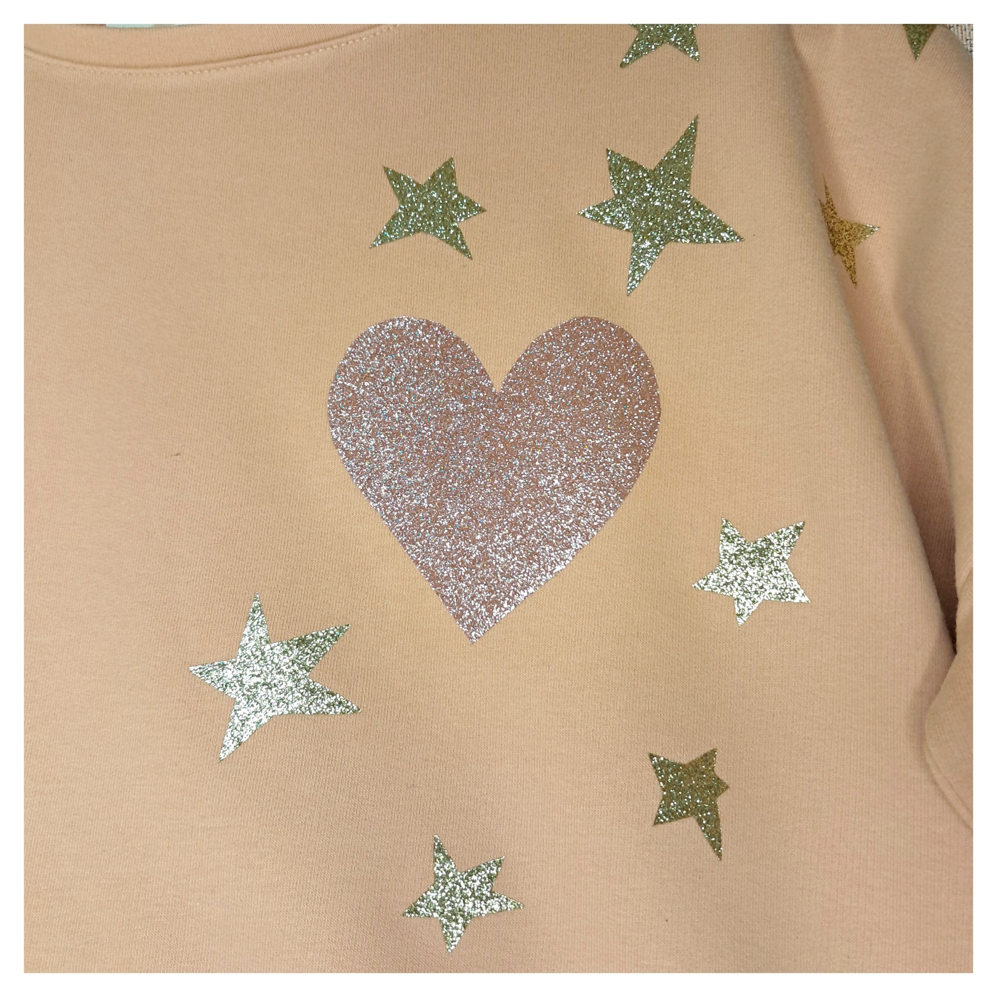 recycled, upcycled pink pullover with our lady of guadalupe pattern. glitter heat press