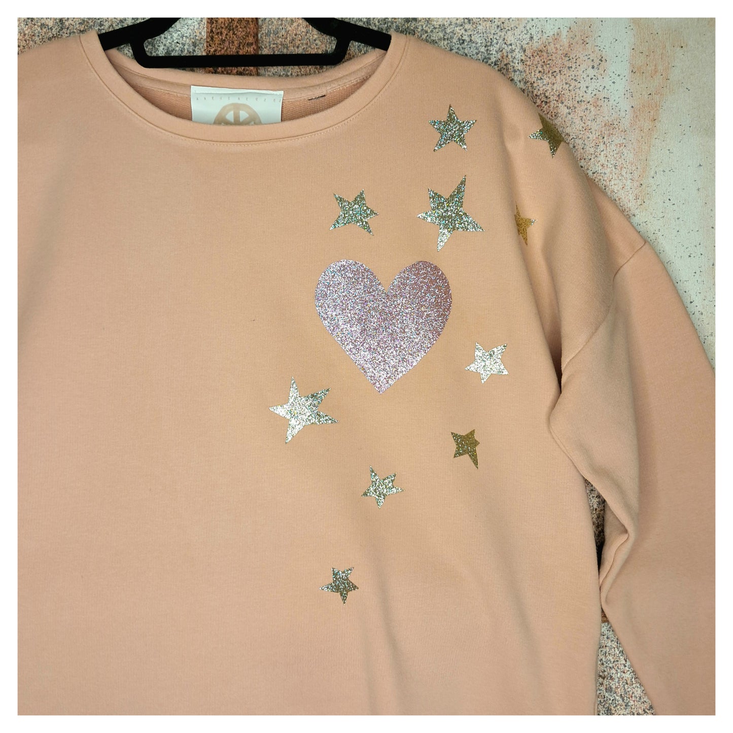 recycled, upcycled pink pullover with our lady of guadalupe pattern. glitter heat press