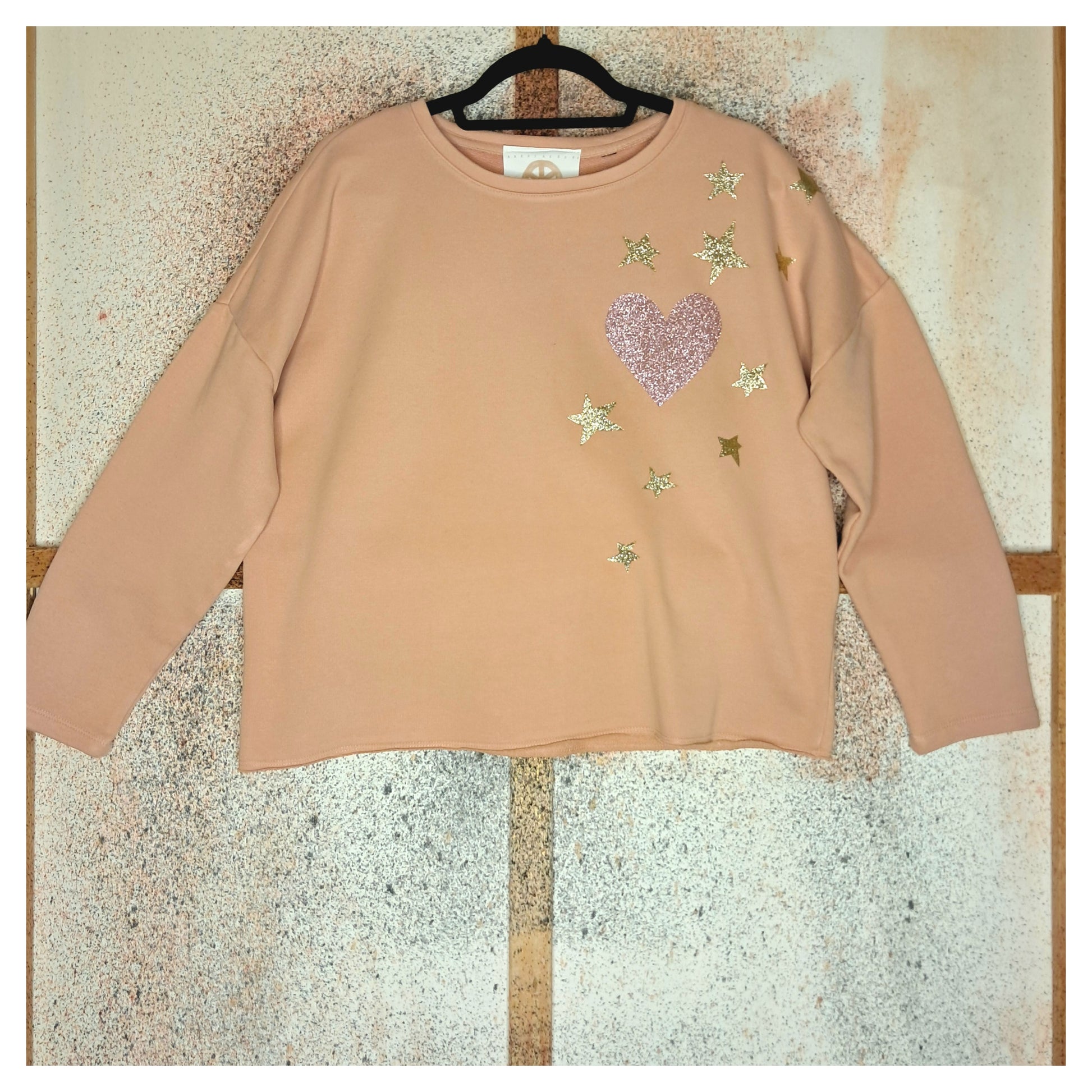 recycled, upcycled pink pullover with our lady of guadalupe pattern. glitter heat press
