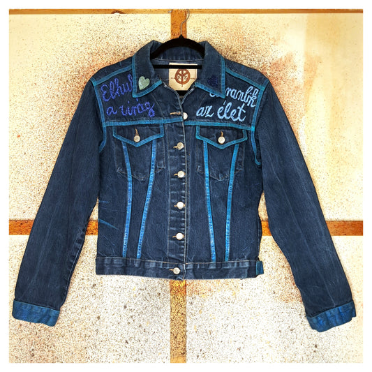 Recycled, upcycled blue denim jacket with hand embroyed with glitter skull on back